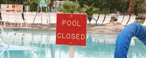 A swimming pool that is closed for cleaning