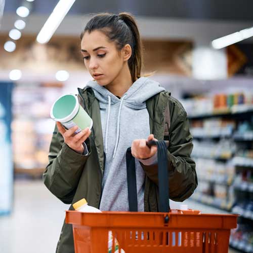Woman reading dairy label