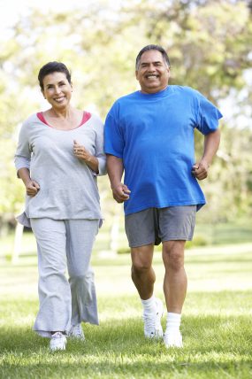 Senior couple jogging in a park