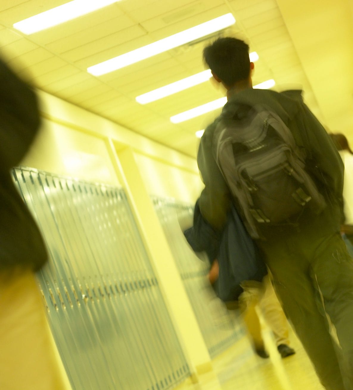 A student walking in school hall way