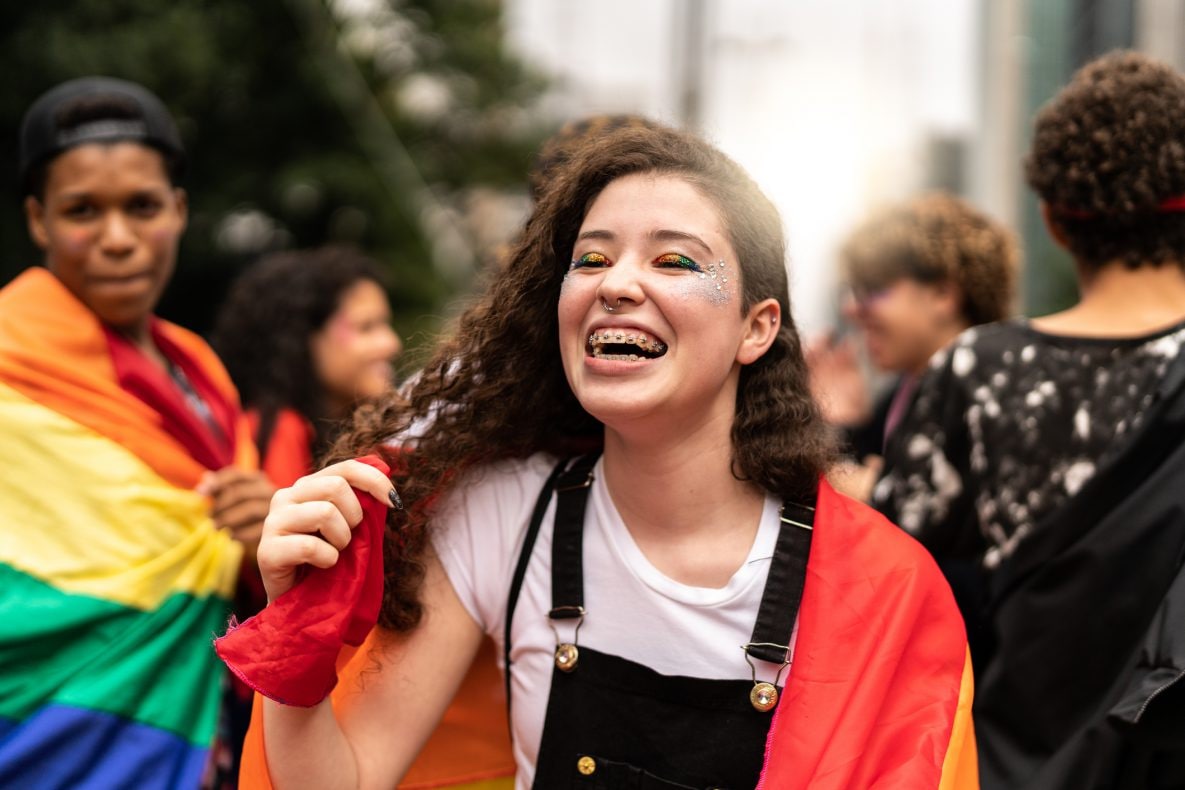 Portrait of smiling Lesbian Young Woman on an LGBTQ parade