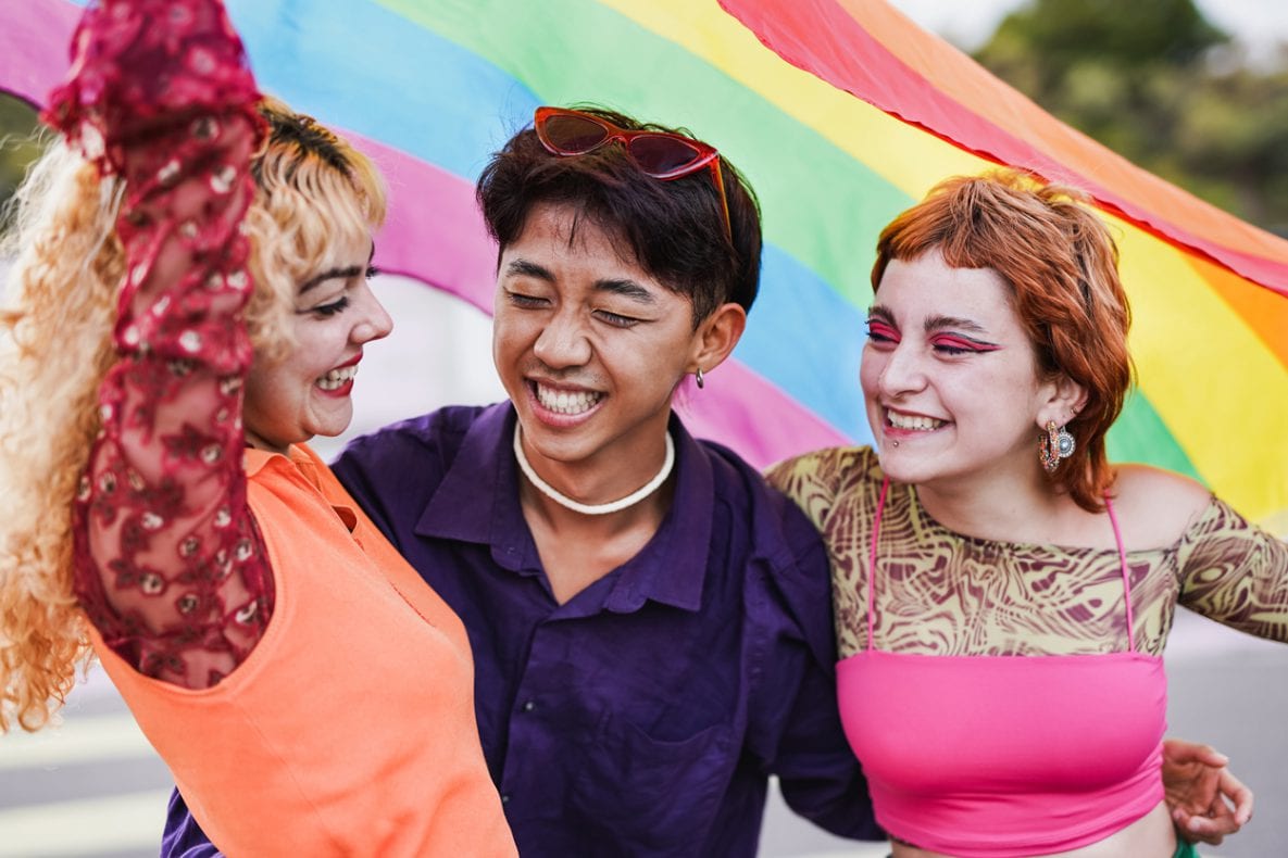Young diverse people having fun at LGBT pride parade