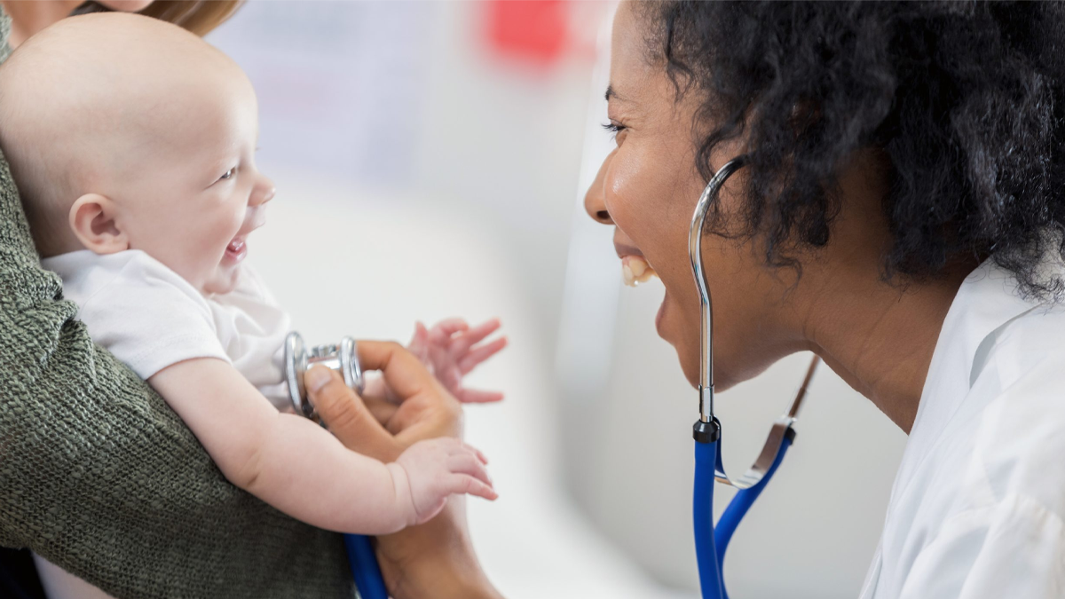 Doctor interacts with infant