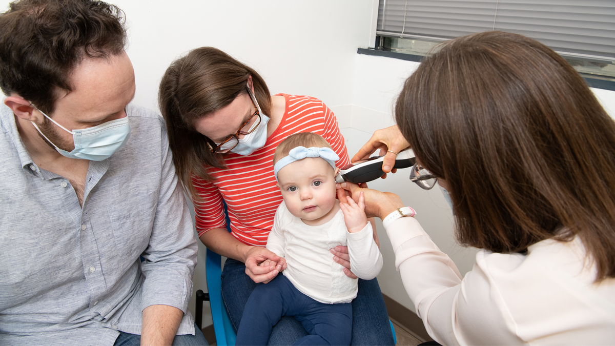 daughter getting a checkup at the doctor's office