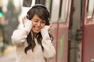 girl wearing noise cancelling headphones