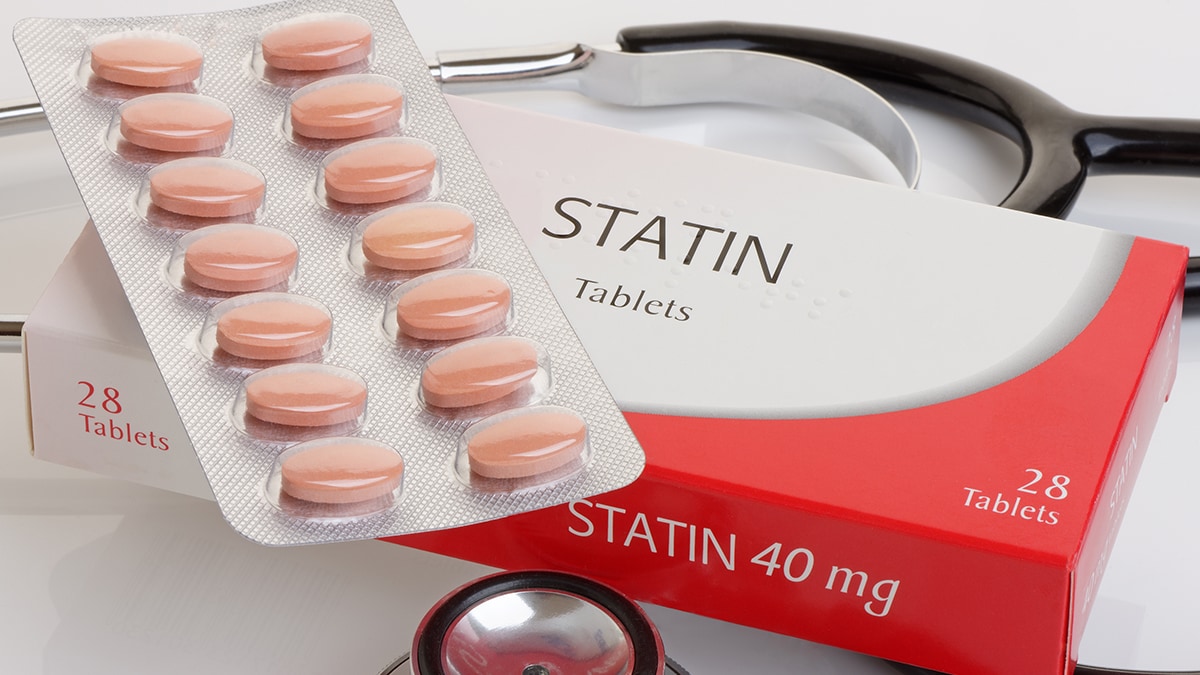 a tablet sleeve labeled STATIN and a stethoscope