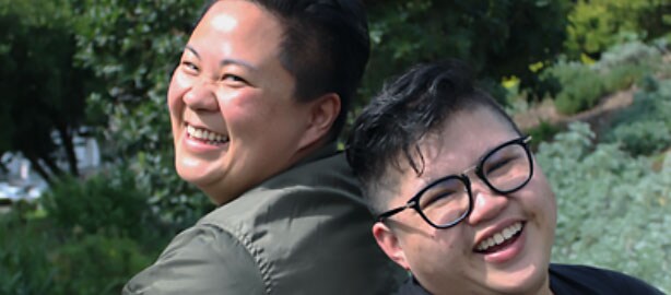 One Asian woman and one Asian man smiling with their backs against each other. National Asian and Pacific Islander HIV/AIDS Awareness Day. May 19. Raise awareness about the impact of HIV-related stigma on Asian and Pacific Islander communities.