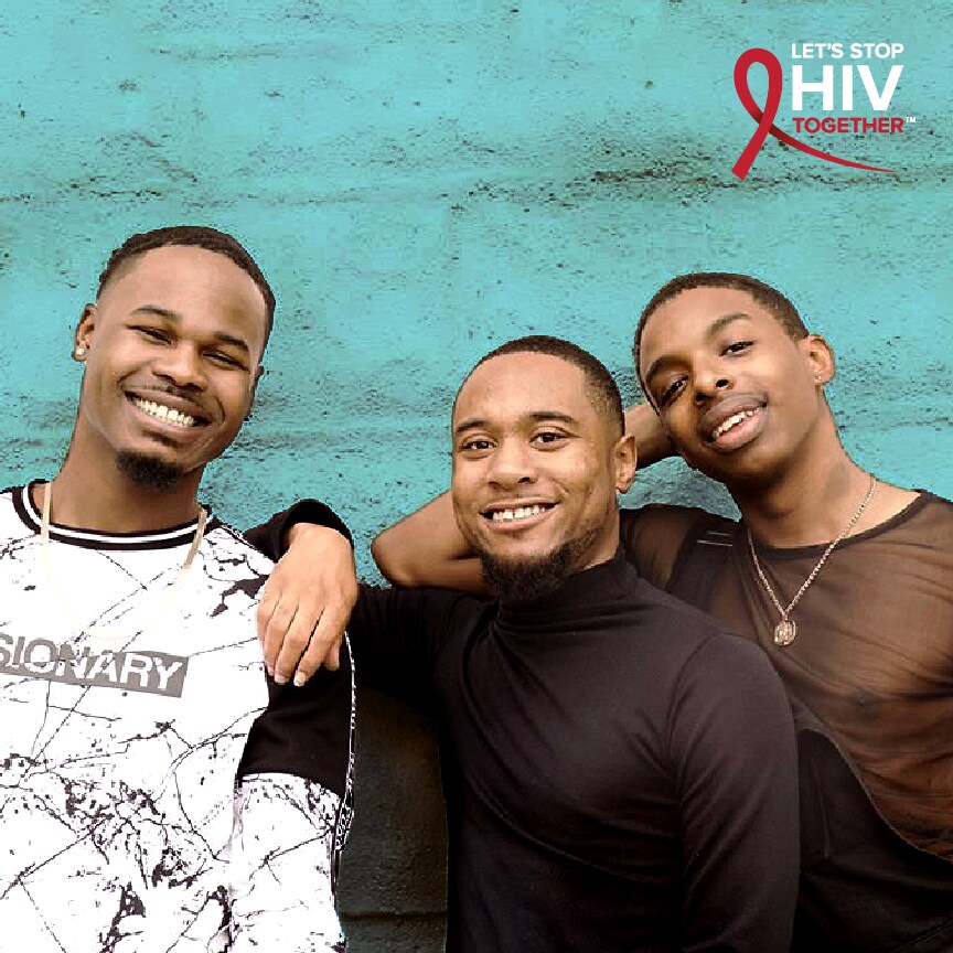 Let's Stop HIV Together. Three African American men stand outside with arms around each other.