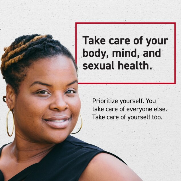 A close-up of a woman smiling. In the background, text reads, “Take care of your body, mind, and sexual health. Prioritize yourself. You take care of everyone else. Take care of yourself too.