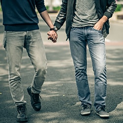 2 men holding hands
