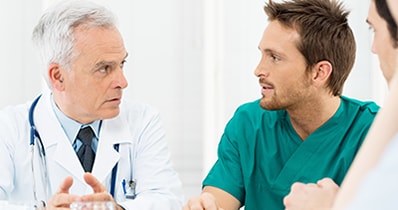 photo of a doctor talking to a man