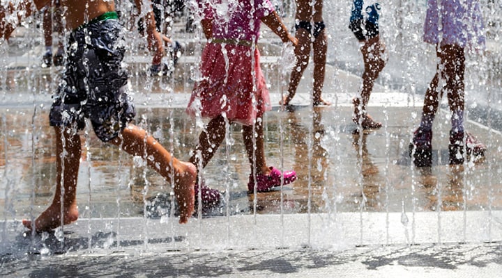 children playing at a splash pad