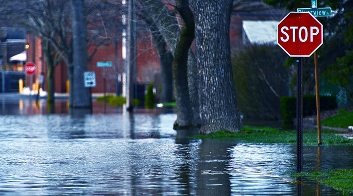 Street signs on flooded street