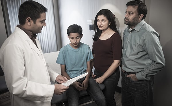 Doctor talking to family