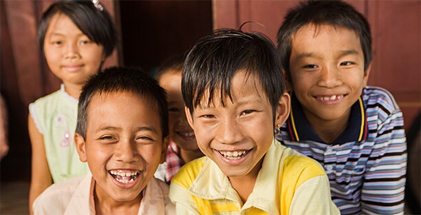 group of smiling refugee children