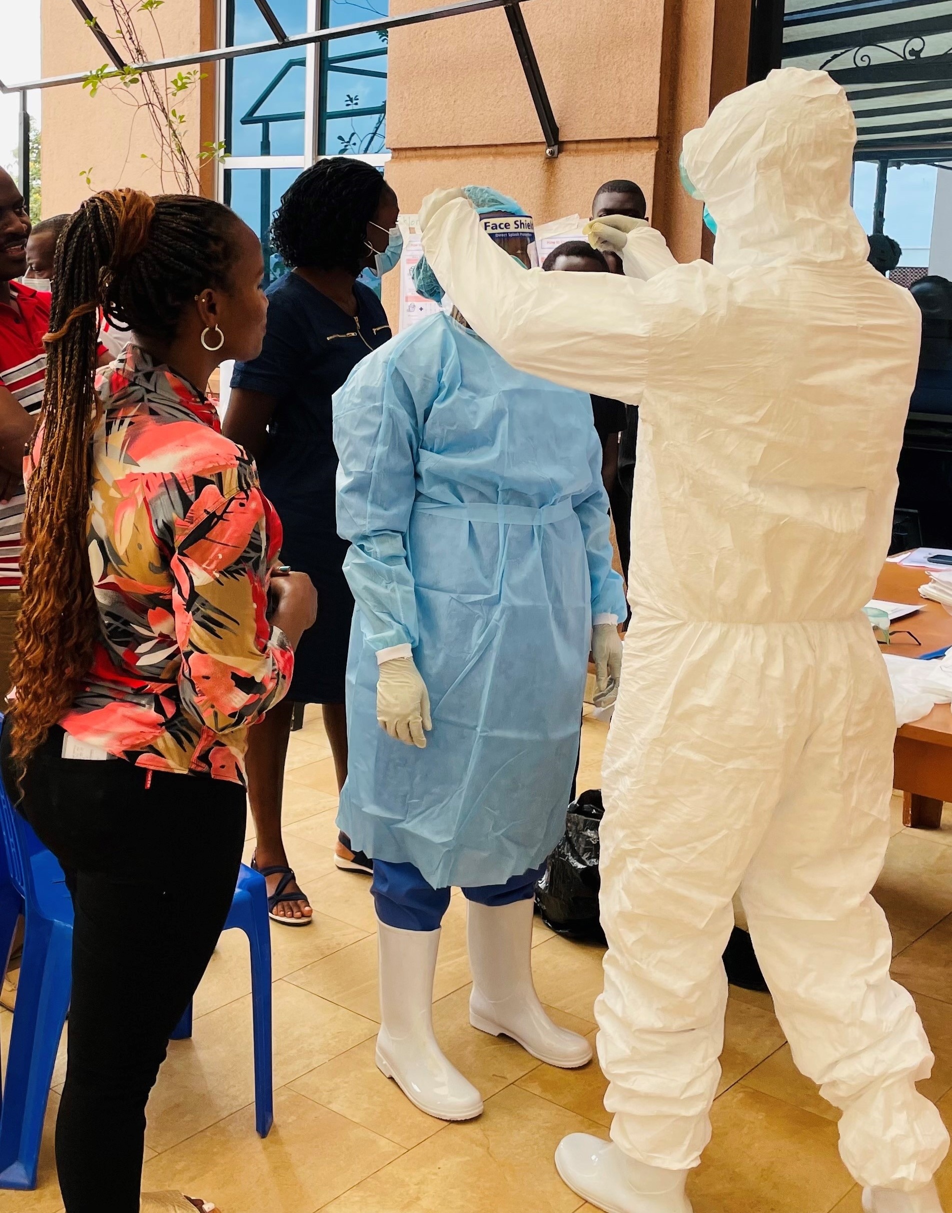 Healthcare workers donning PPE in a training