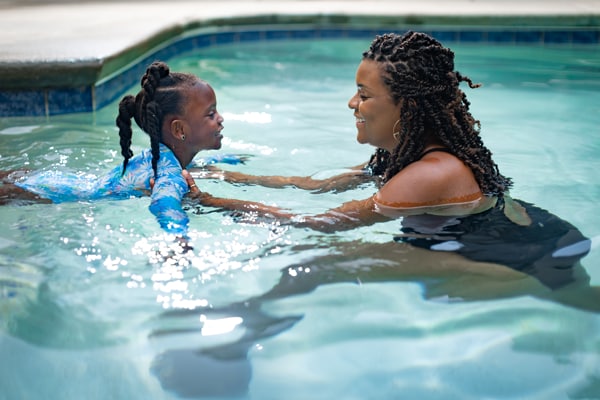 mother and child in swimming pool