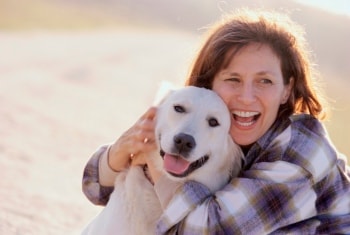 image of a young woman hugging a dog