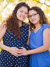 Hispanic pregnant women and her daughter