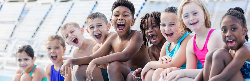 Group of children having fun together at a water park