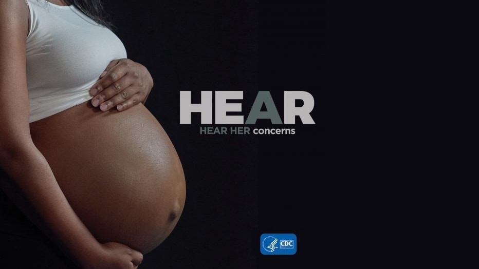 Woman holding pregnant belly with HEAR HER Concerns text displayed