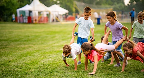 Children playing and racing in a campground
