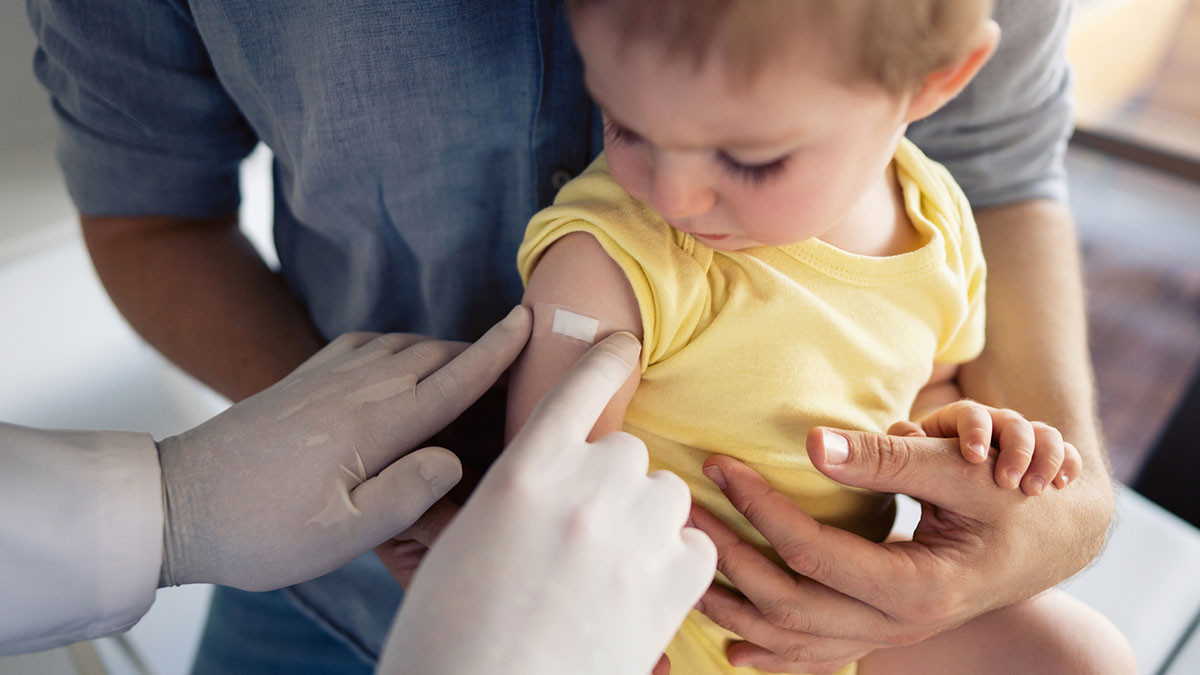 Provider giving mmr vaccine to child Provider administering vaccine to young child.