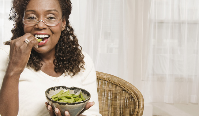 woman eating healthy greens