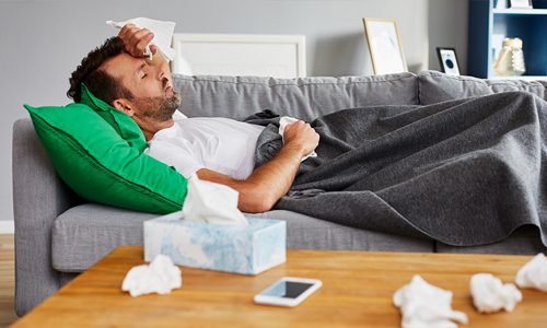 Sick man on a couch