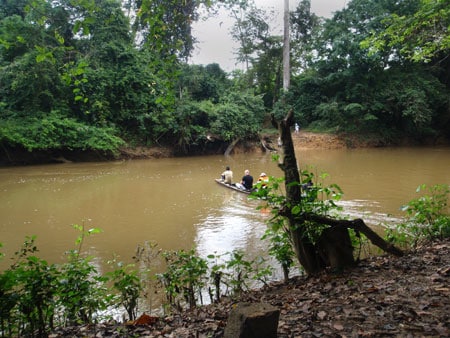 CDC RITE team members ride in a dugout canoe during their journey to Geleyansiesu&lt;strong&gt;,&lt;/strong&gt; Liberia, a rural village with reported Ebola cases.