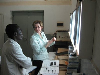 MAP Team member, Captain Mary Naughton, reviews chest x-rays with a panel physician in Ghana.