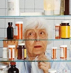 older woman looking in medicine cabinet