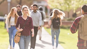 students walking on campus grounds