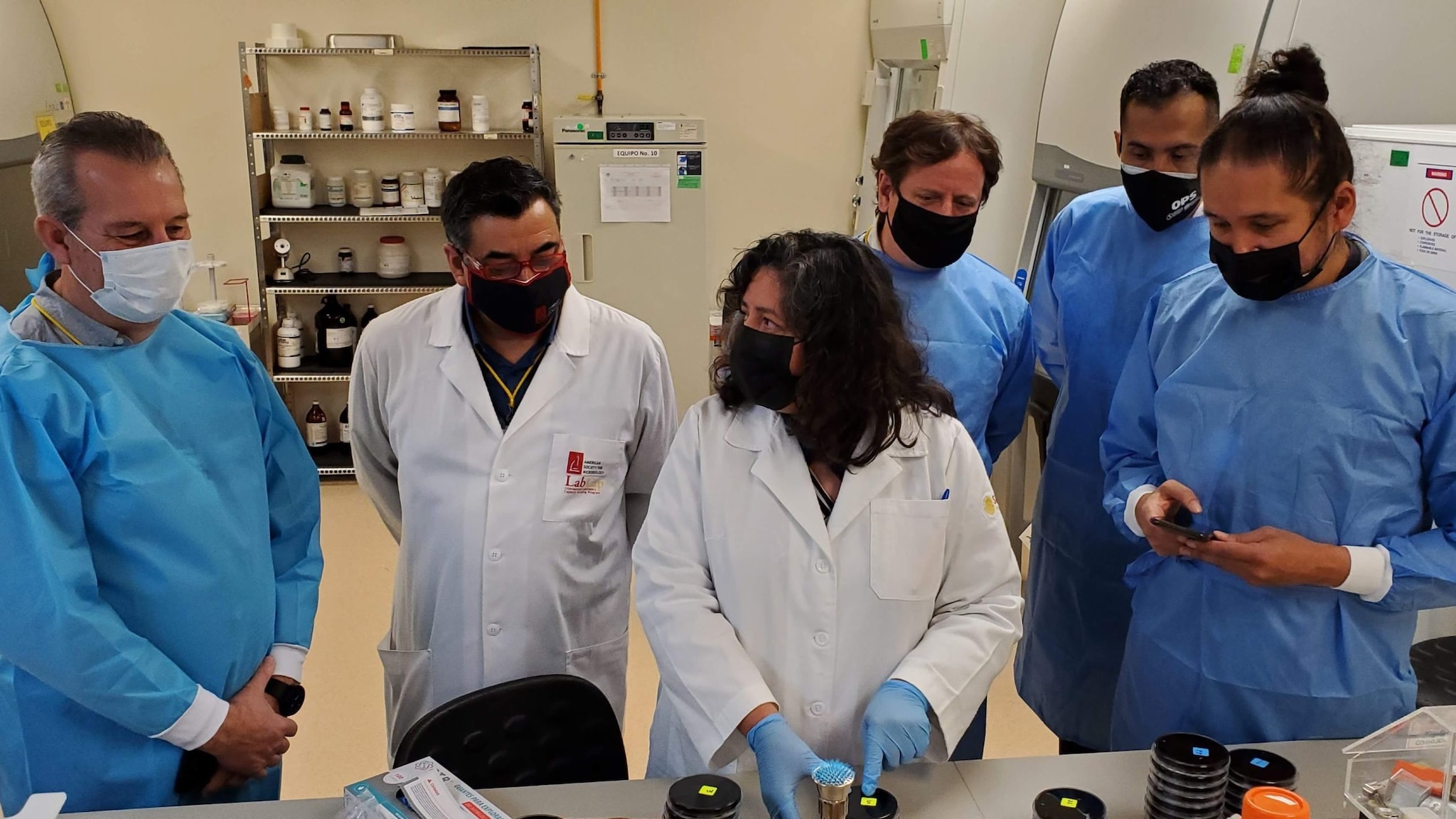 Laboratory scientists looking at lab specimen samples
