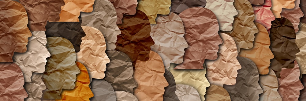 paper silhouettes of people representing multiple races and ethnicities