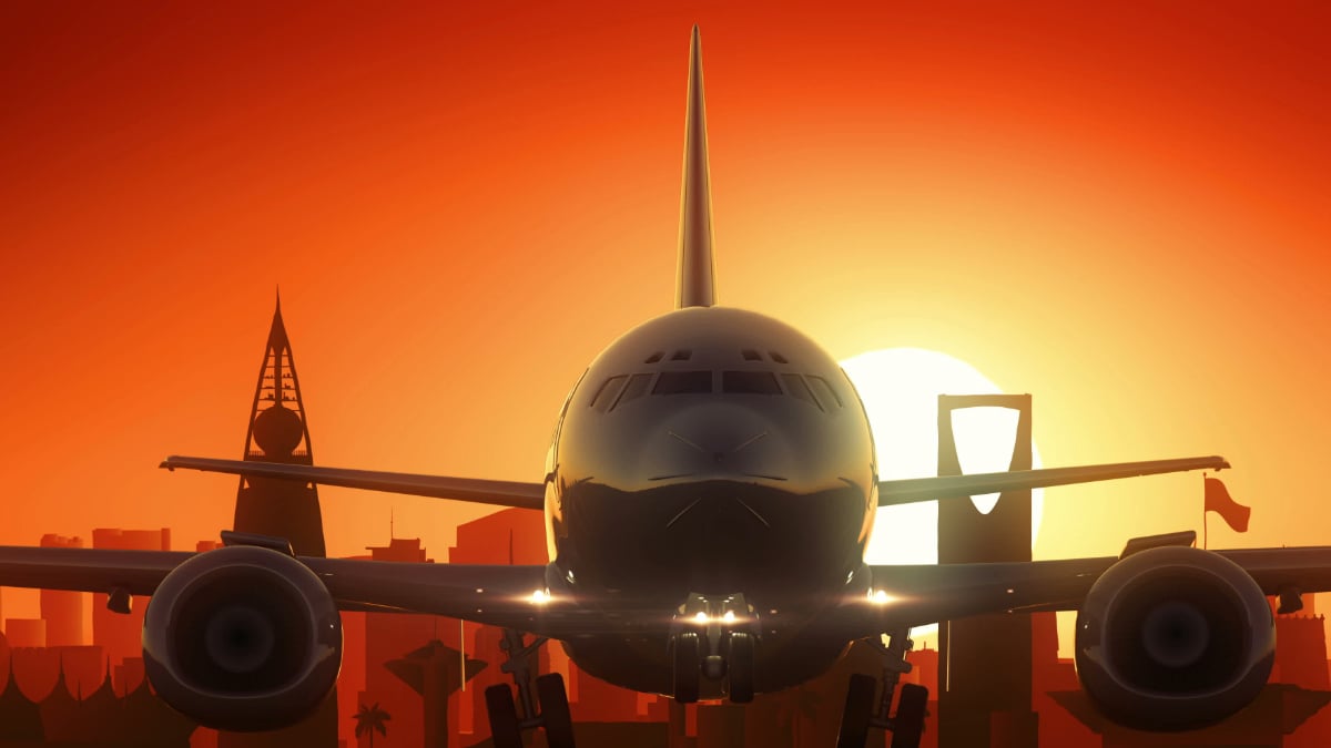 The image shows a plane in the foreground with a sunset in the background.