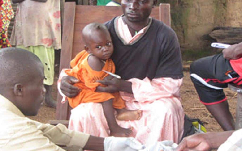 A village child being treated 