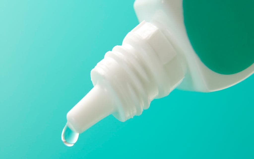 An opened contact solution bottle. Contact solution bottles can be contaminated with AK