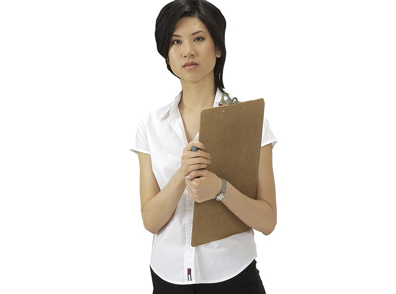 Woman carrying a clipboard.