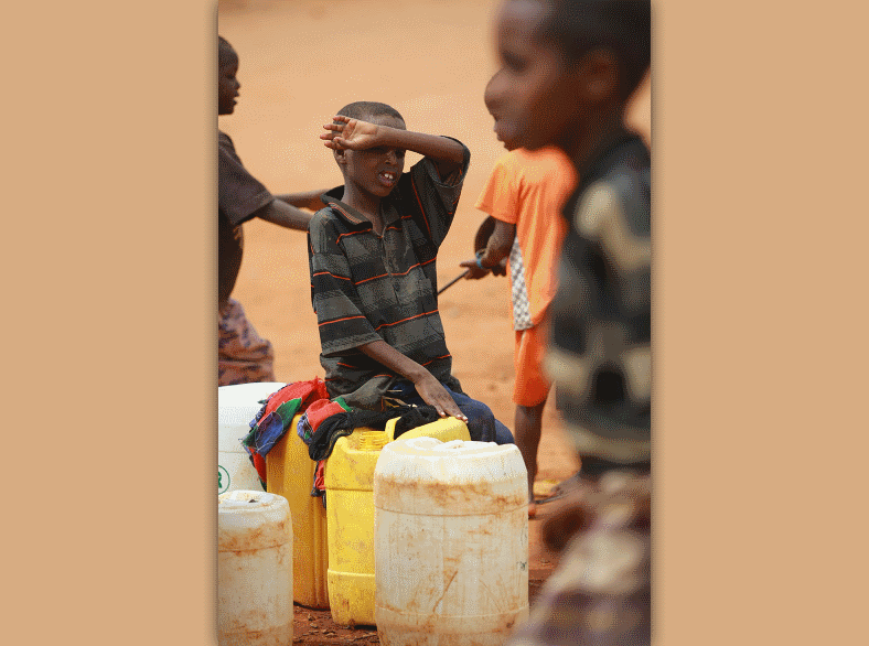 children fetching water at the refugee camp