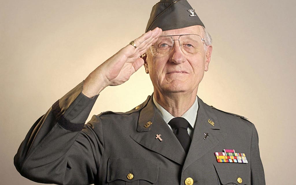 A military veterans saluting.