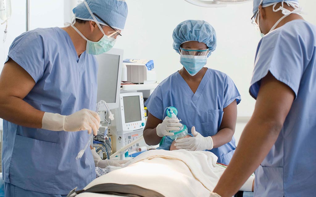 Patient in a surgery room with doctors and nurses.