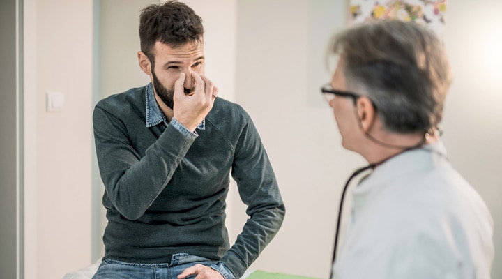 physician and a patient with sinus condition