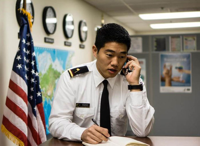 begin-public-health-career Adult speaking on a phone and taking notes