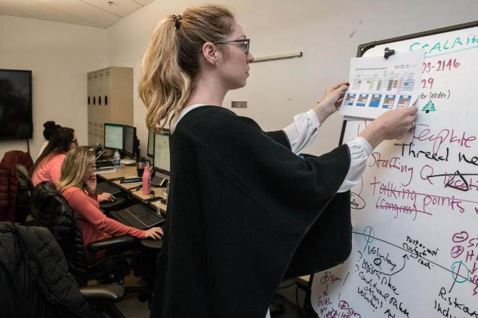 public-health-degrees Woman at a whiteboard