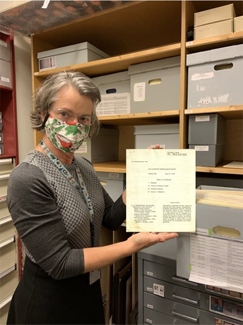 CDC Museum Collections Manager Mary Hilpertshauser with 1960 CDC Hepatitis Surveillance Report