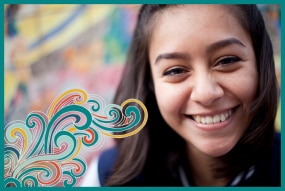 Teen smiling with colorful swirls