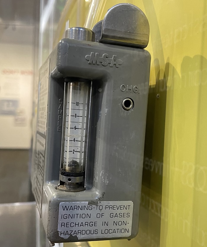 A close-up side view of the MSA Portable Pump Model G clearly shows the sample tube and its numeric markings.