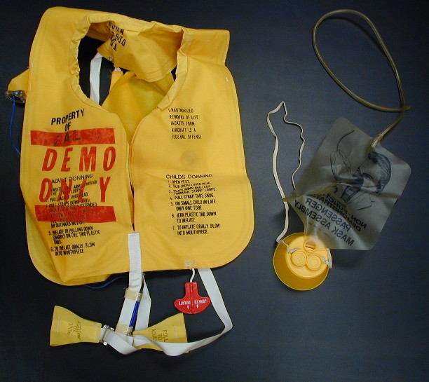 "Red Spots" among Flight Attendants This bright yellow life vest and oxygen mask are souvenirs from the “Red Spots” Epi-Aid. Donated by Kathy Rauch, 1995, 1995.136.1, CDCM Collection
