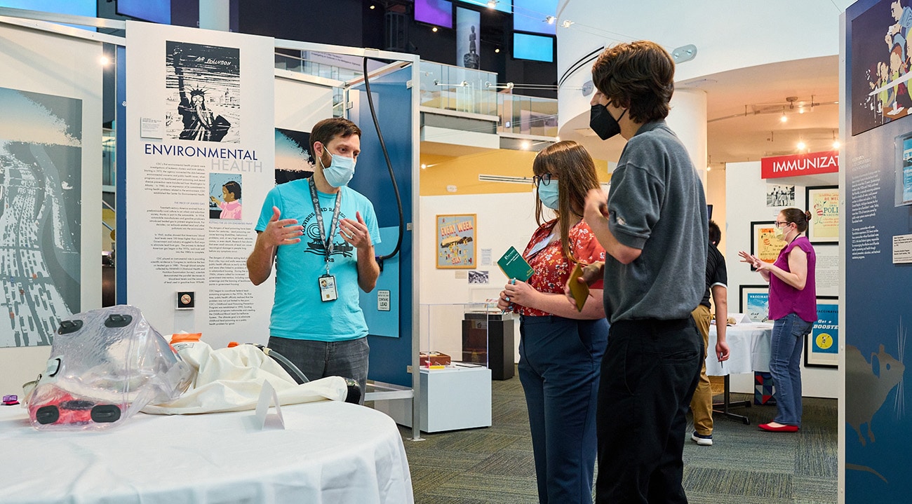 Students talking to a CDC museum presenter